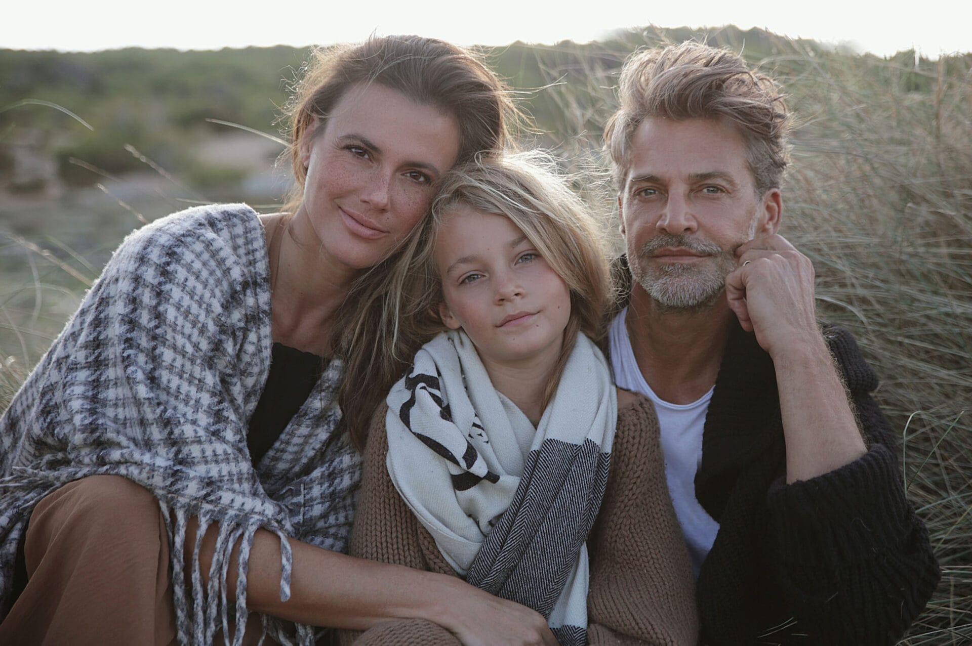 happy mallorca model family sitting in nature