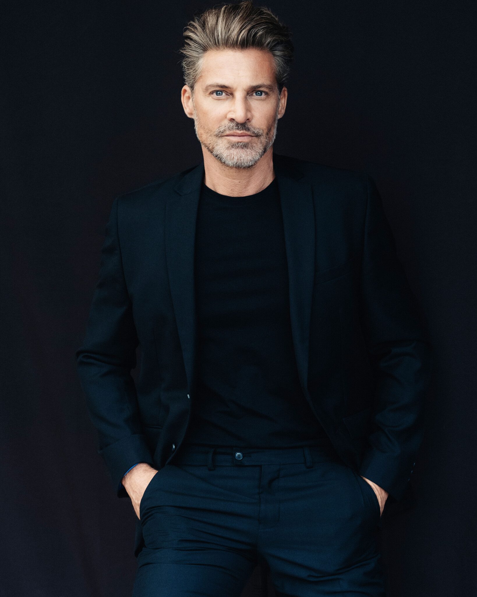 male model shooting bestager black suit