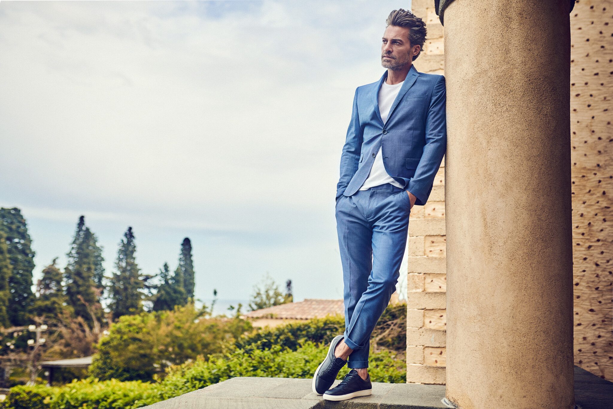 male model shooting blue suit italy