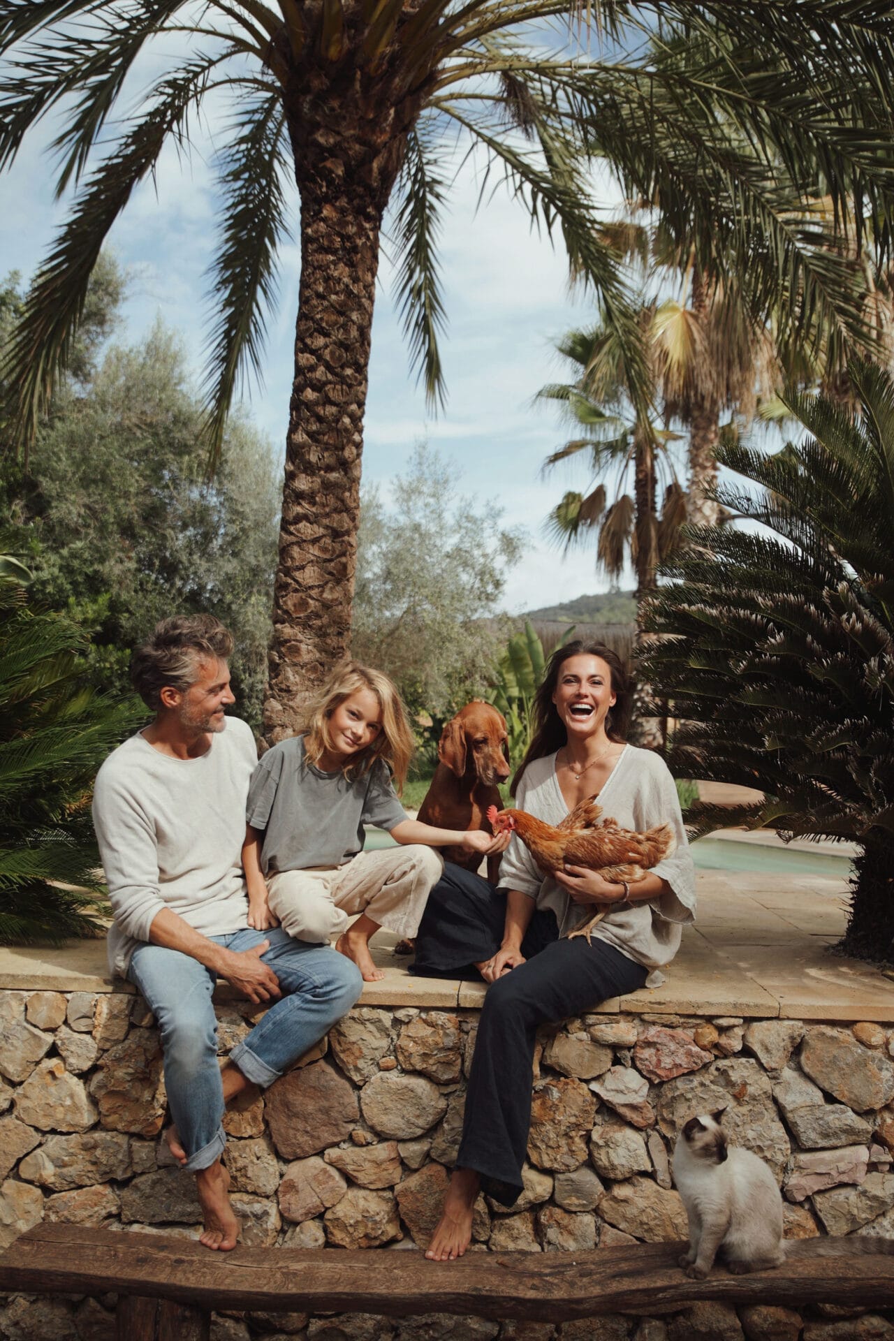 mallorca happy model family photoshoot dog chicken finca