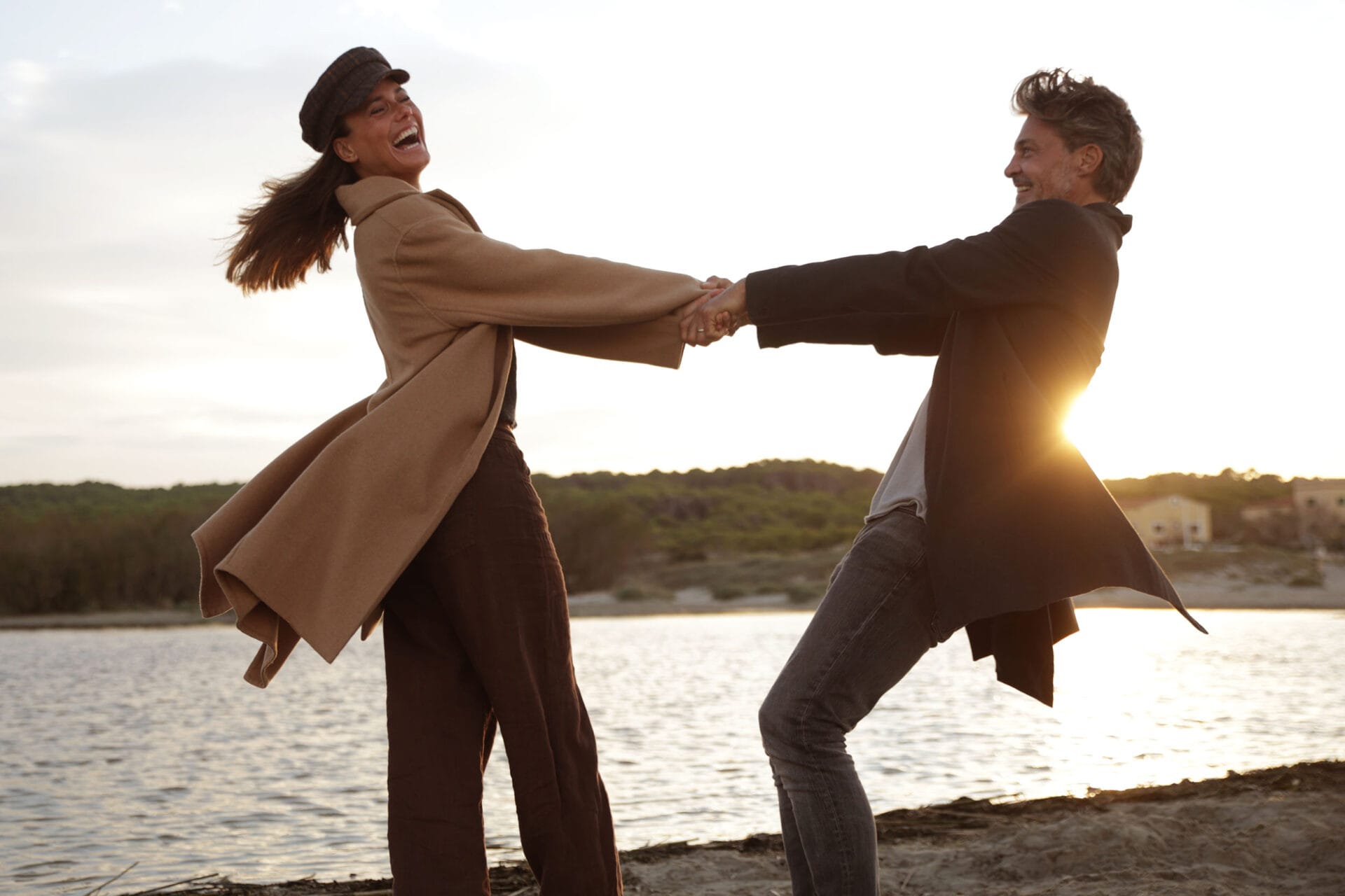 model couplemallorca dancing at the beach sunset