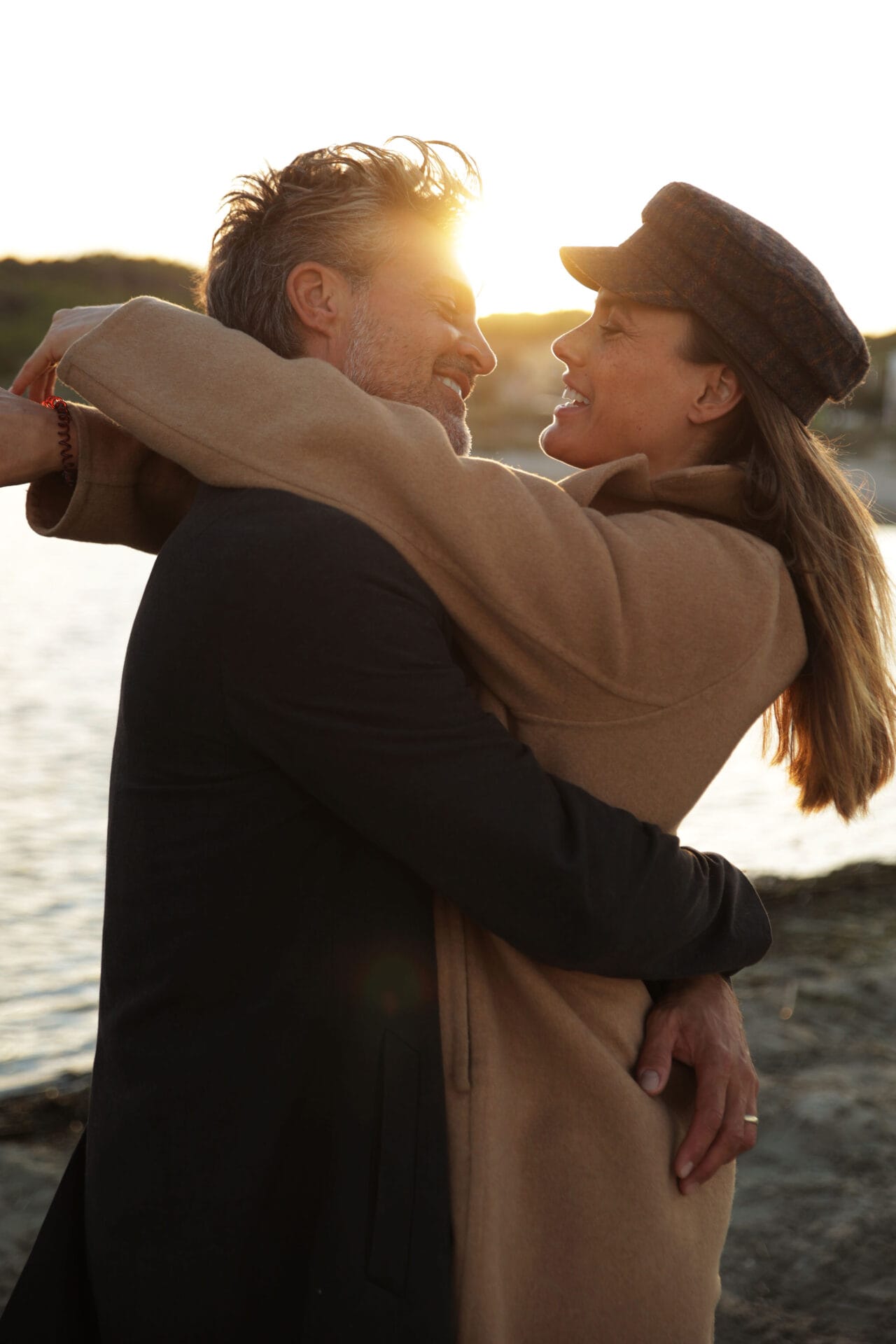 model couplemallorca smiling profiles at the beach sunset
