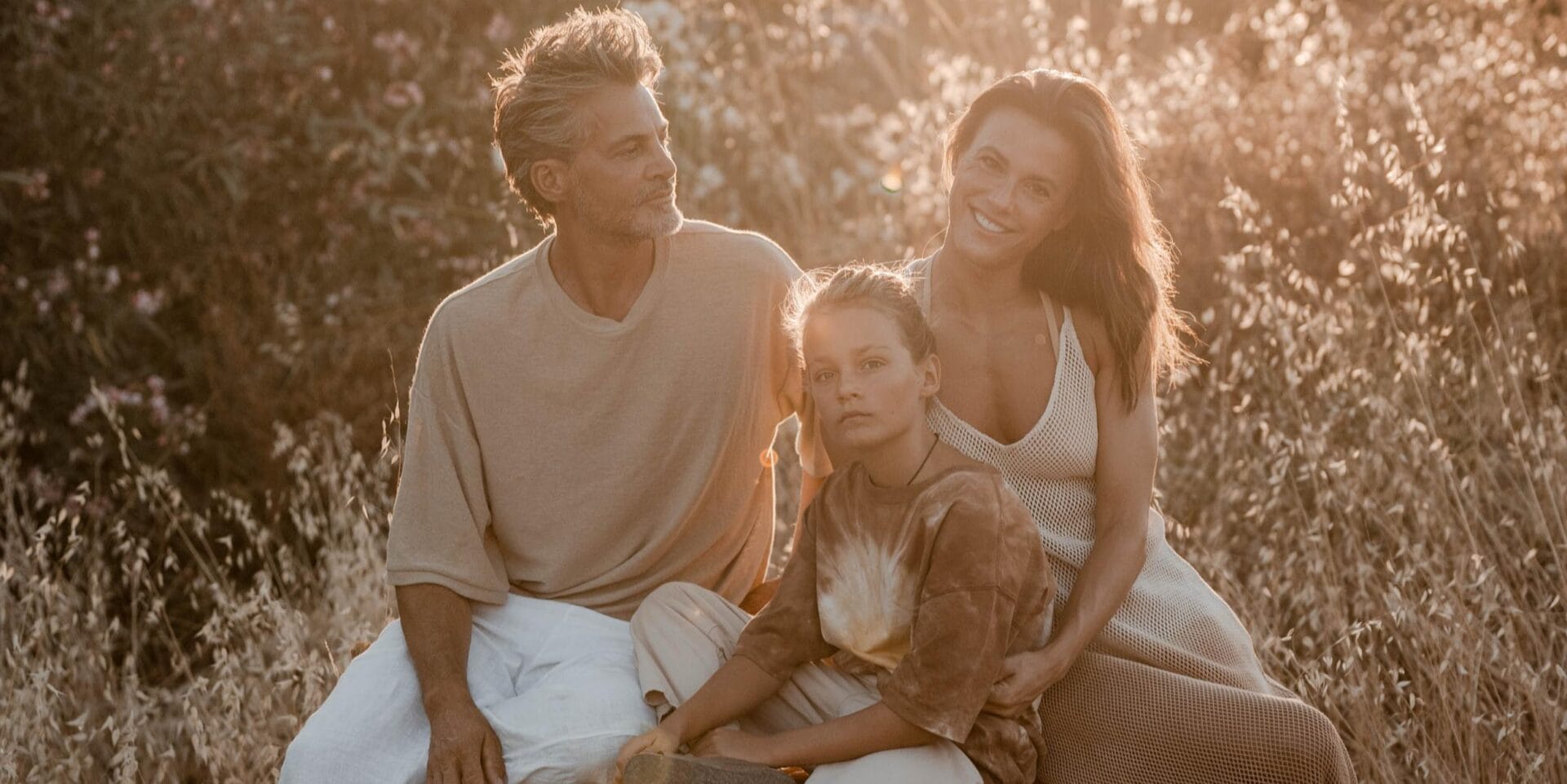 model family sitting sunset golden light